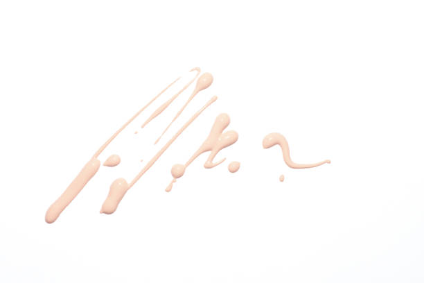 Tone base cream stroke. Drop of make-up tone base on isolated white. liquid foundation face stock pictures, royalty-free photos & images