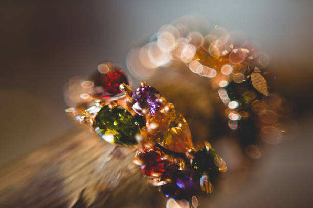 istock Earrings with gemstones hang on tree branches 1192138877