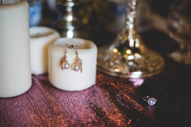 istock Jewelry earrings on a table with decorative elements 1192138898
