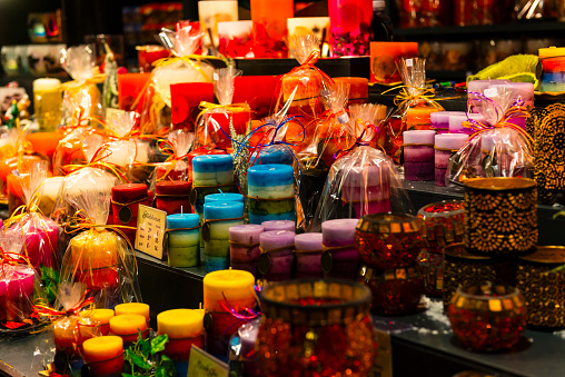 Karlsruhe, Germany - December 03, 2019: colorful christmas market in Karlsruhe with lot of illuminated huts. Here is a candle shop.
