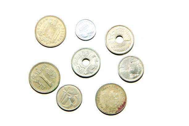 istock Old, invalid coins from Spain isolated on a white background. 1192140922