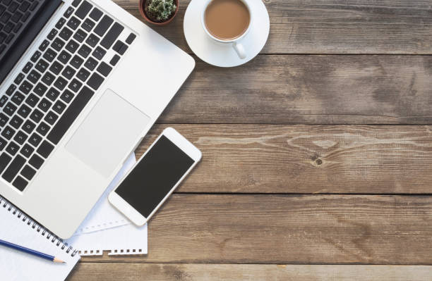 istock Office desk table with laptop, supplies and tablet . Top view with copy space 1192141306