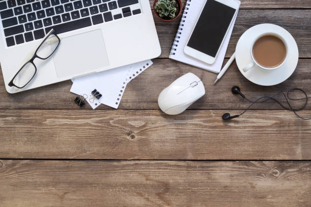 istock Office desk table with laptop, supplies and tablet . Top view with copy space 1192141385