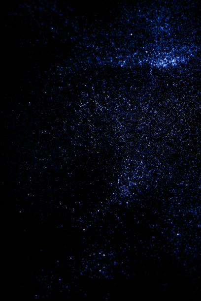 istock Classic shiny black background with blue glitter . 1192143057