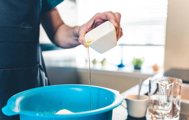 istock Hands of Man making pizza 1192144397
