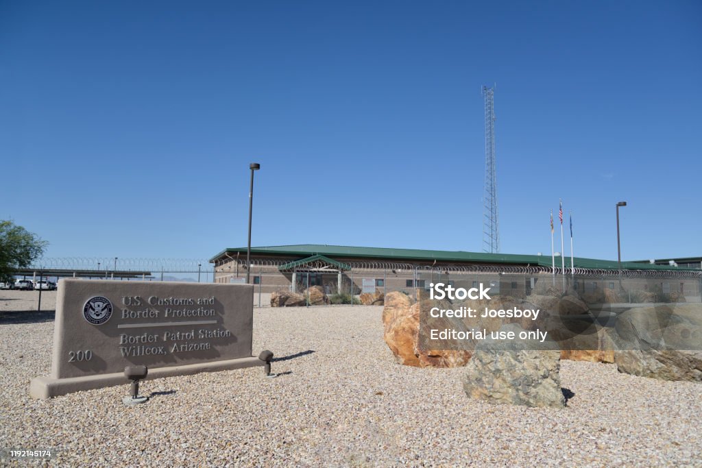 US Customs and Birder Protection Station wilcox, arizona  - October 5, 2019: US Customs and Border Protection Border Patrol Station complex with gravel landscaping, huge boulders and the requisite fence and detention facility Detention Center Stock Photo