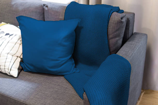istock blanket and blue pillows on the sofa in the interior 1192146323