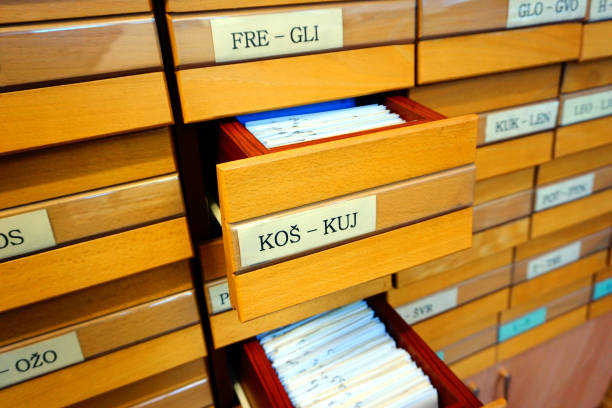 istock Open wooden drawer box on an old library catalog 1192146687