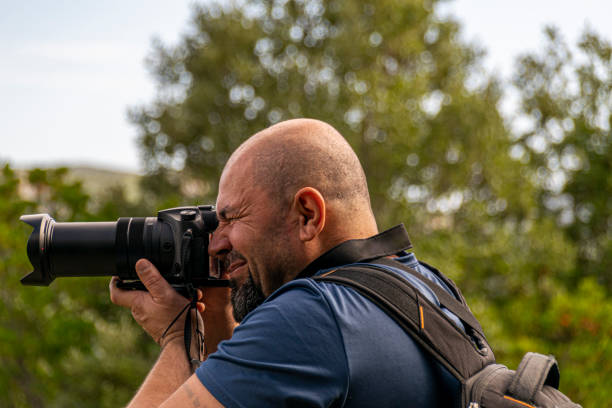 istock man tourist photographer on a mountain 1192148264