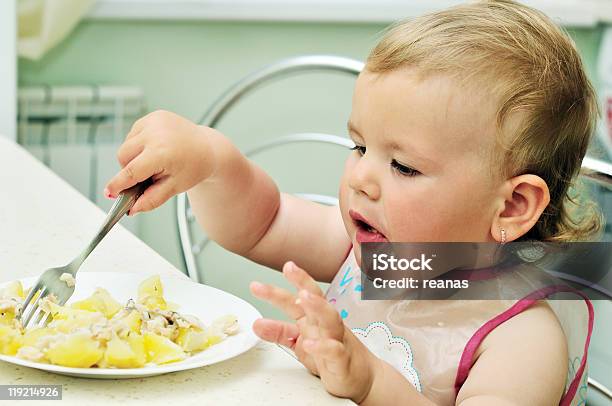 Baby Girl Eating With Fork Stock Photo - Download Image Now - Beautiful People, Beauty, Carefree