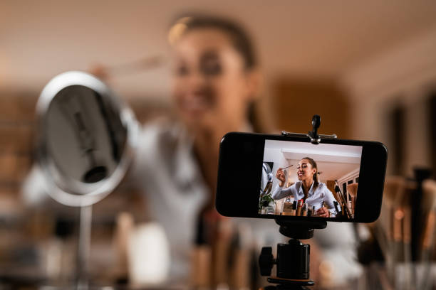 istock Close-up of female vlogger recording make-up tutorial at home. 1192149888