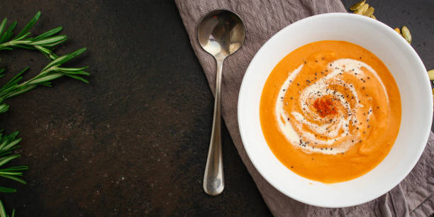 istock pumpkin soup (first course, delicious vegetable vitamin food) menu concept. food background. copy space. Top view 1192149974