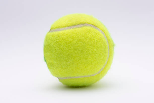 istock Isolated yellow tennis ball on white 1192151335