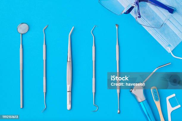 Dentist Tools Over Blue Background Top View Stock Photo - Download Image Now - Backgrounds, Blue, Body Care