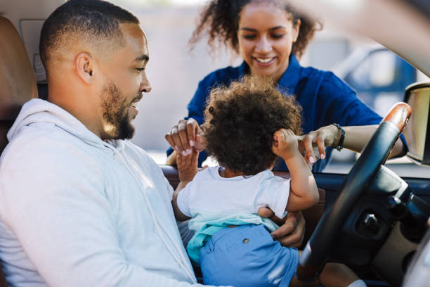 istock Young mother playing with his son. Little boy sitting on father's hips. 1192154105