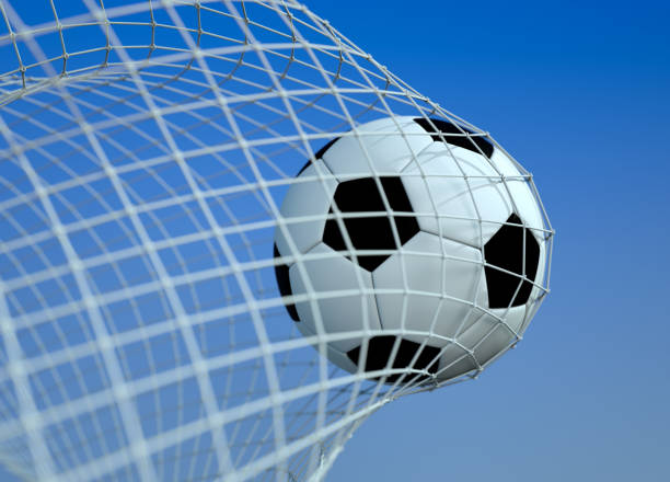 istock Soccer ball in goal 1192156427