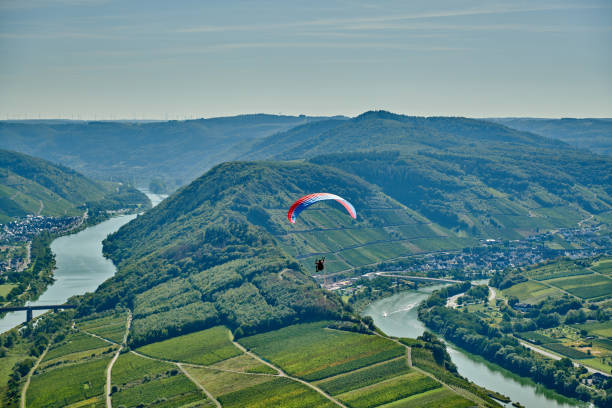 Paraglider above the Mosel loop in Bremm, Germany