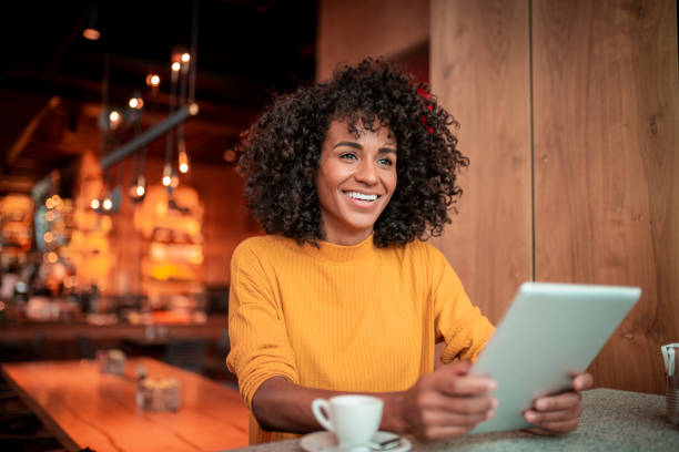 istock Portrait of a beautiful woman using a digital tablet 1192158068
