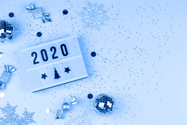 istock figures 2020 on light box with snowflakes, balls, and decorations with small stars 1192158903