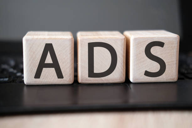 istock Text word ads on wooden cubes on a black tablet 1192159233