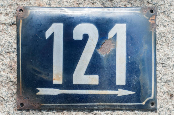 istock Weathered enameled plate number 121 1192161358
