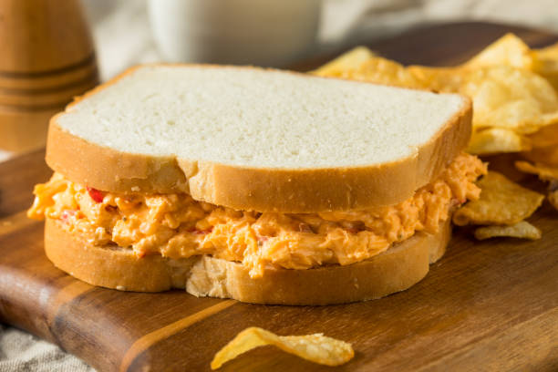 Homemade PImento Cheese Sandwich Homemade PImento Cheese Sandwich with Potato Chips colby cheddar stock pictures, royalty-free photos & images