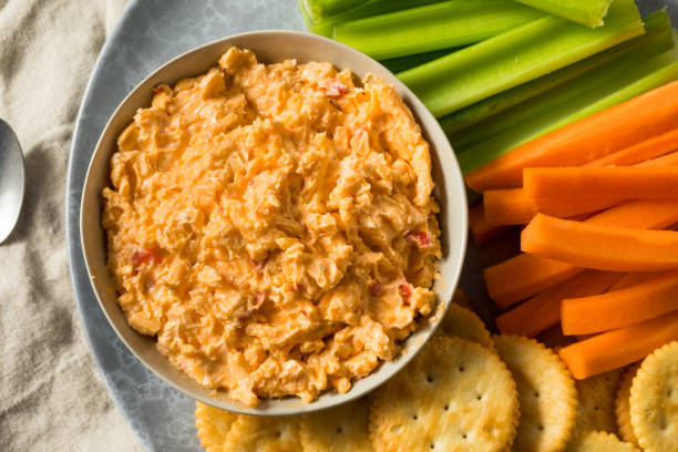 Homemade Pimento Cheese Spread Homemade Pimento Cheese Spread with Crackers and Veggies cheese dip stock pictures, royalty-free photos & images