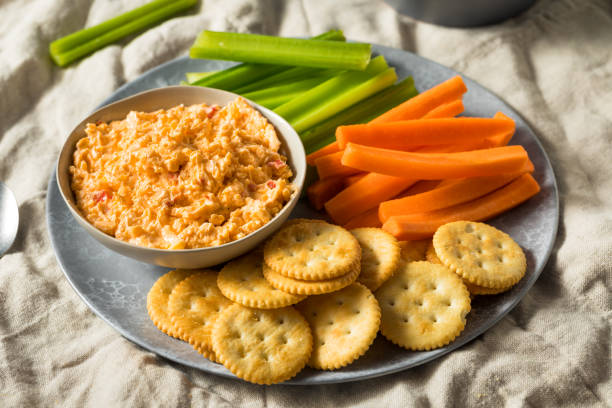 Homemade Pimento Cheese Spread Homemade Pimento Cheese Spread with Crackers and Veggies cheese dip stock pictures, royalty-free photos & images