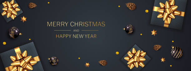 istock Gift Box with Golden Holiday Bow and Christmas Balls on Black Baclground 1192164114