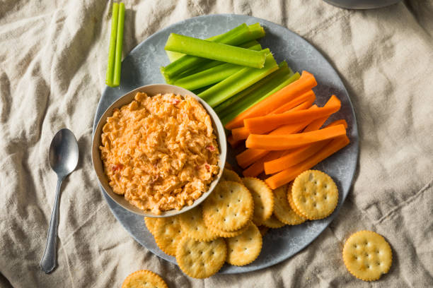 Homemade Pimento Cheese Spread Homemade Pimento Cheese Spread with Crackers and Veggies cheese dip stock pictures, royalty-free photos & images