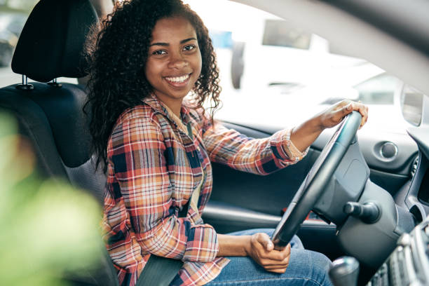 Millennial Driver Millennial Driver car insurance photos stock pictures, royalty-free photos & images