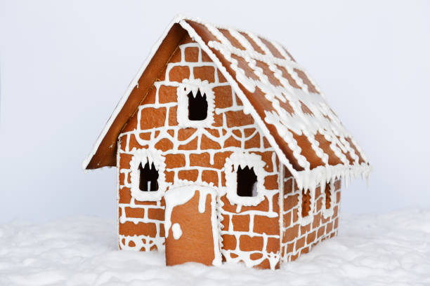 istock The hand-made eatable gingerbread house and snow decoration 1192170363
