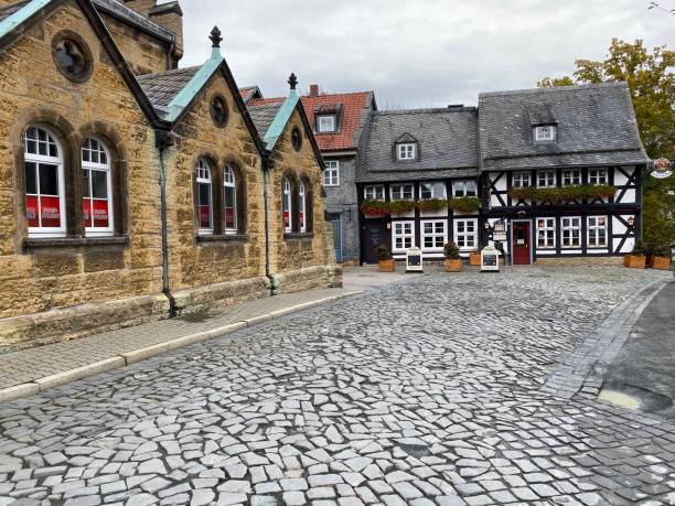 Goslar, Germany - November, 8 - 2019: Typical street and half timbered houses in the old town.