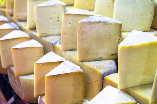 istock stacked and sliced old cheddar on bazaar counter 1192171934