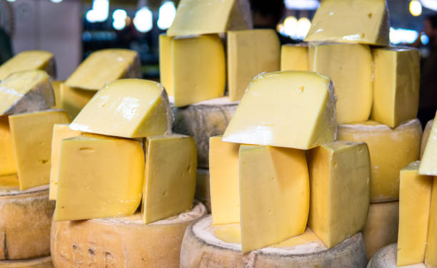 stacked and sliced old cheddar on bazaar counter