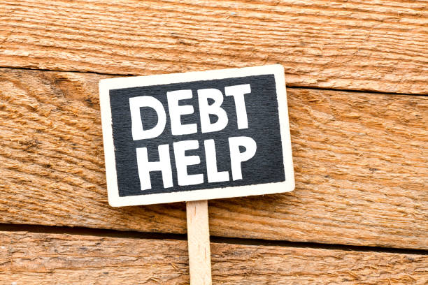 istock Debt Help text on a small chalk board. View from above. High resolution photo - business concept. 1192174690