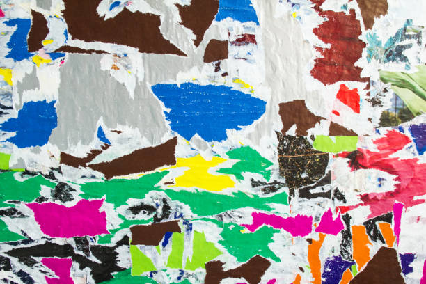 istock Motley colorful torn and peeling old paper posters and placards layers texture background. 1192177908