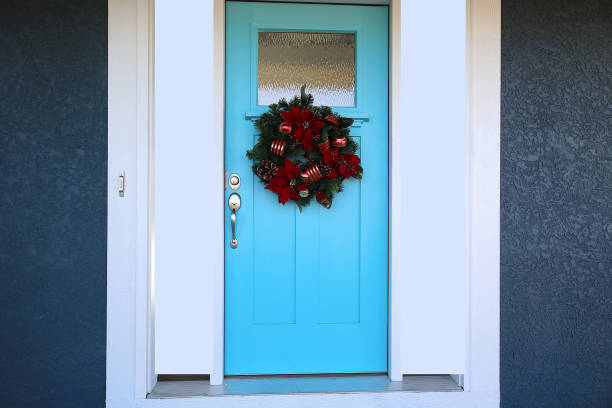 istock Blue Door with Red Christmas Wreath 1192185468
