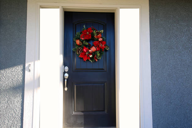 istock Black Door with Red Christmas Wreath 1192185525