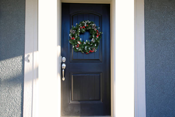 istock Black Door with Christmas Wreath 1192185563