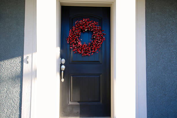 istock Black Door with Christmas Berry Wreath 1192185584