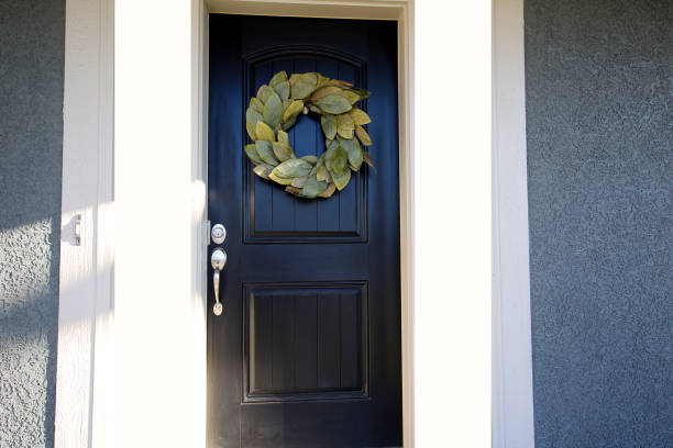 istock Black Door with Leaf Wreath 1192185587