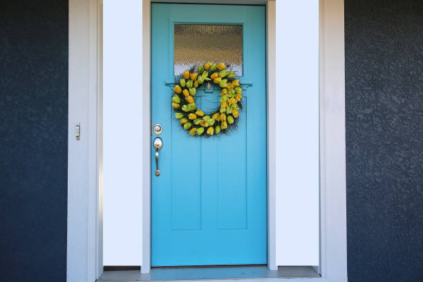 istock Blue Door with Tulip Wreath 1192185595
