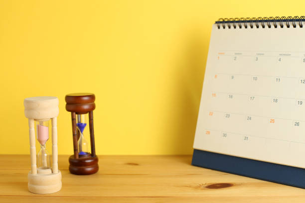 istock Calendar and hourglass on table, Business schedule and time concept 1192196816