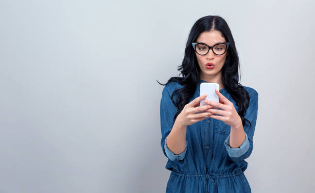 istock Young woman staring at her phone 1192203111