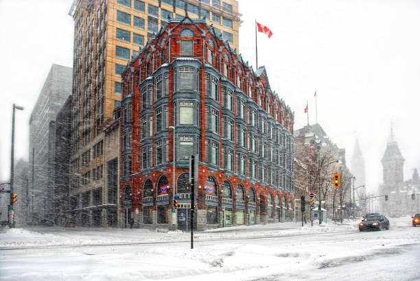 Ottawa, Canada - December 16, 2007: The historic Chambers Building, a National Historic Site, on Elgin Street during a blizzard. The Parliament Buildings are in the background but can barely be seen through the snow.