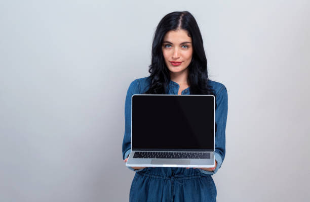 istock Young woman with a laptop computer 1192203174