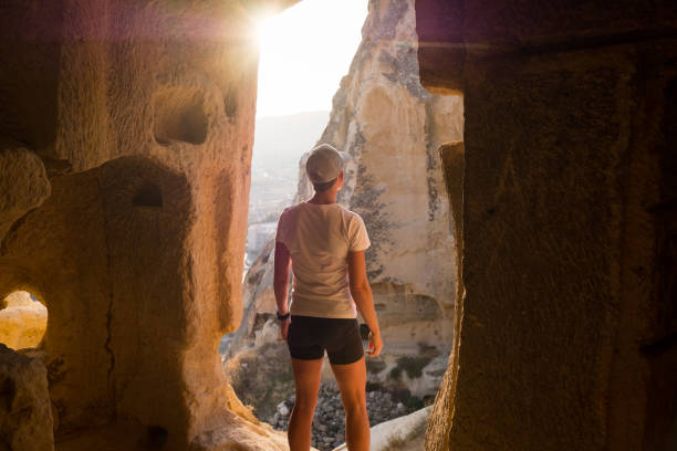 istock Woman exploring old caves in Turkish city 1192204338