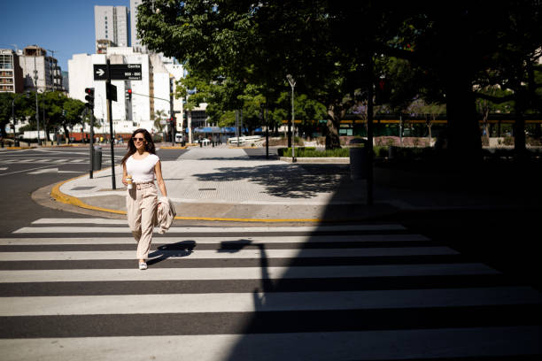 istock Woman walking on pedestrian crossing line 1192208677