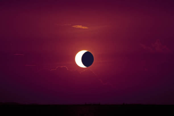 istock amazing phenomenon of sun eclipse over cloud sunset red orange sky 1192211664